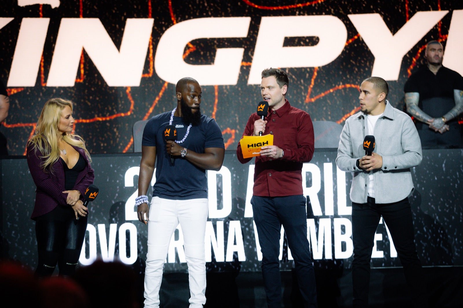 Andy Shepherd hosting a live Kingpyn event on stage